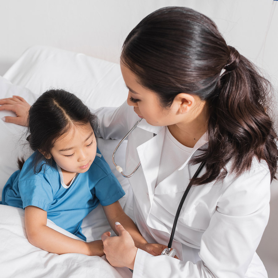 female medical worker with young patient. 